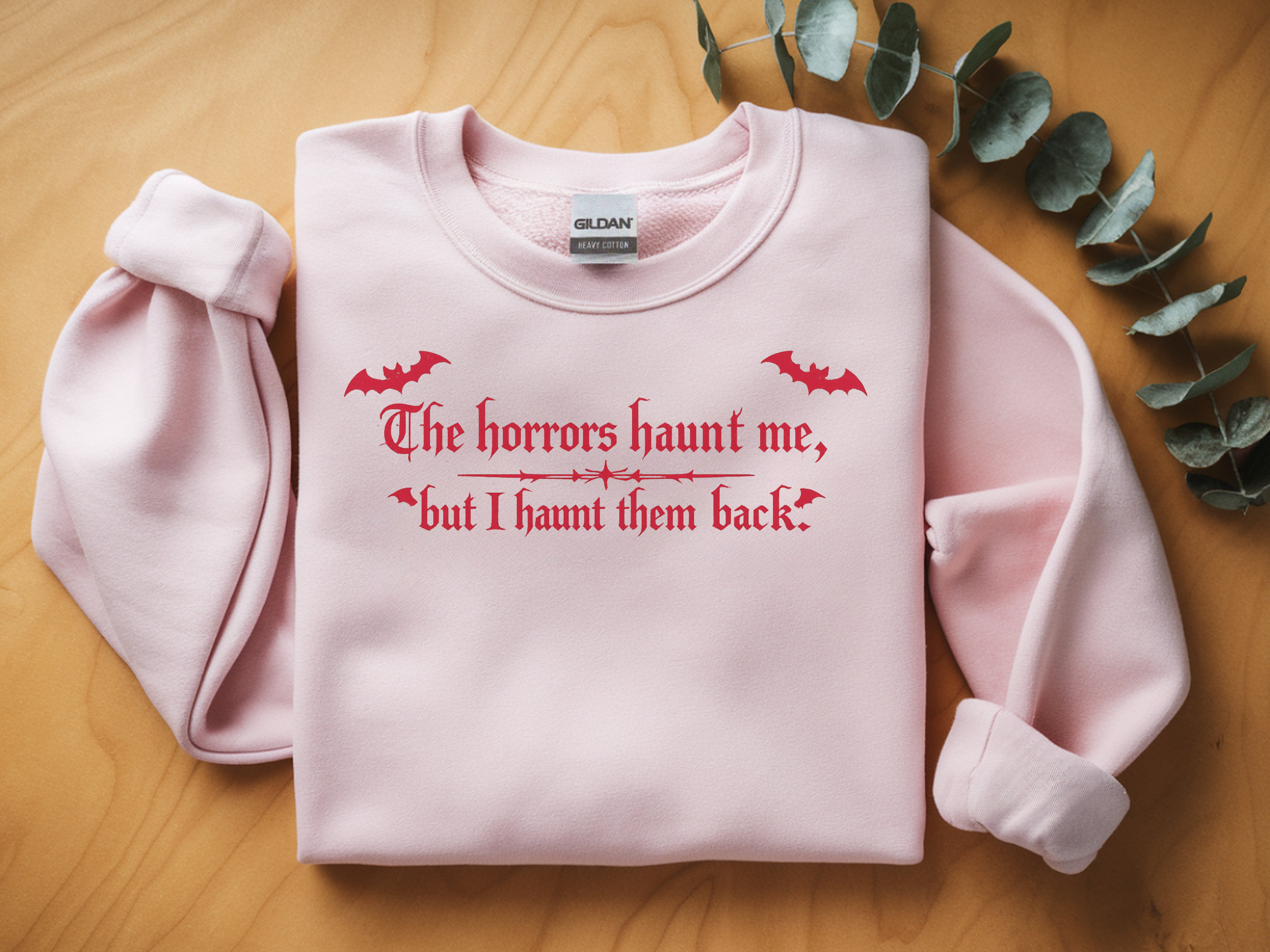 Crewneck Sweatshirt — "The horrors haunt me, but I haunt them back" Red Gothic Halloween Design