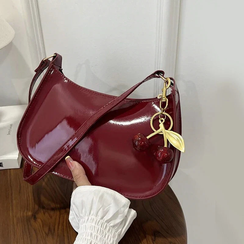 Glossy Hobo Shoulder Bag, Sleek Crescent Handbag with Adjustable Strap, Compact Crossbody Purse with Decorative Charms for Dates & Everyday Use