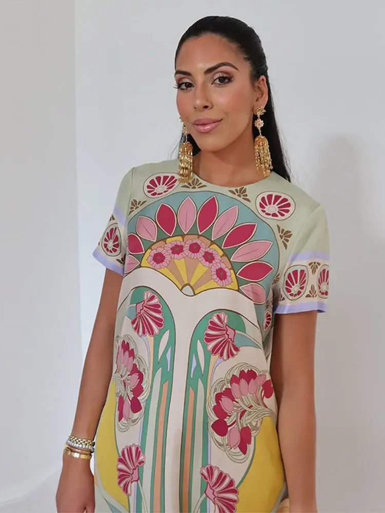 Boho Floral Maxi Dress – Short Sleeve Printed Dress with Round Neck, Fringe Hem, Flowing Silhouette and Statement Pattern