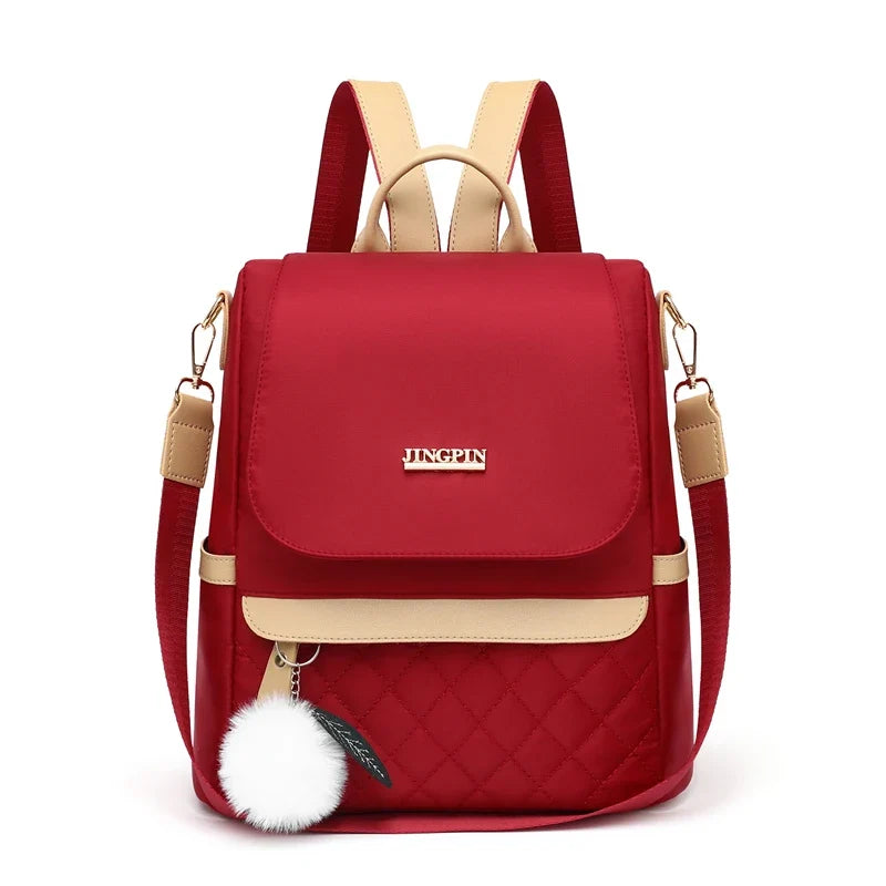 Quilted Mini Backpack Purse, Stylish Convertible Shoulder Bag with Flap Closure, Compact Daypack with Adjustable Straps & Pom Pom Charm