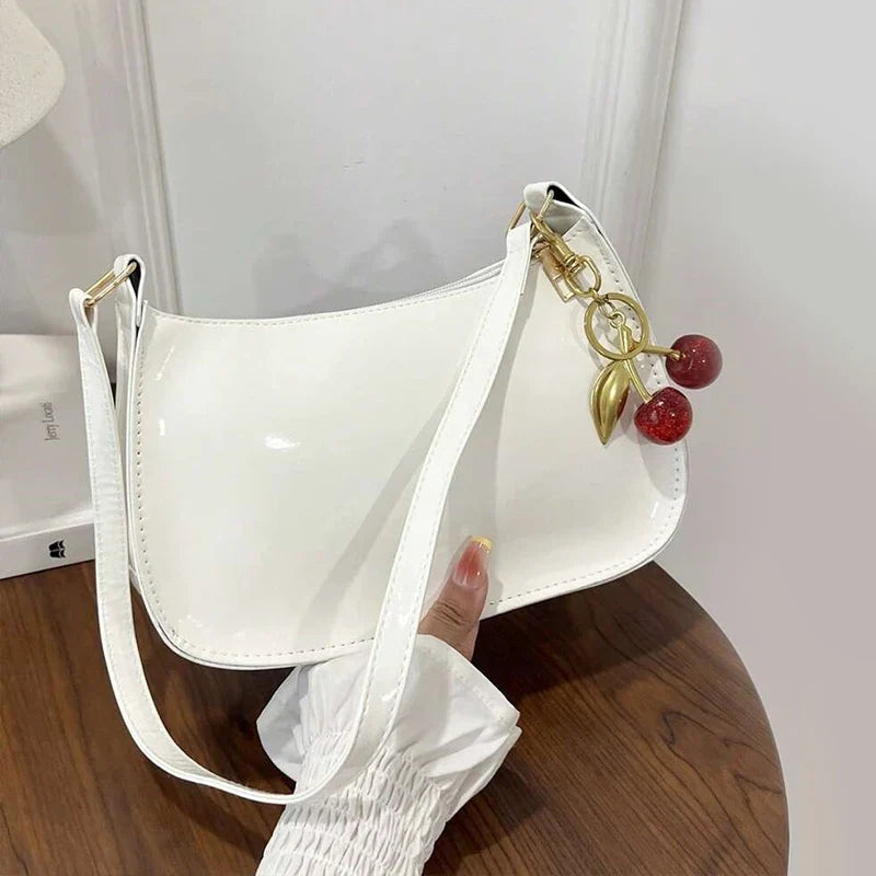 Glossy Hobo Shoulder Bag, Sleek Crescent Handbag with Adjustable Strap, Compact Crossbody Purse with Decorative Charms for Dates & Everyday Use