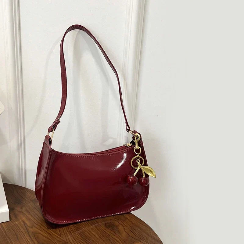 Glossy Hobo Shoulder Bag, Sleek Crescent Handbag with Adjustable Strap, Compact Crossbody Purse with Decorative Charms for Dates & Everyday Use