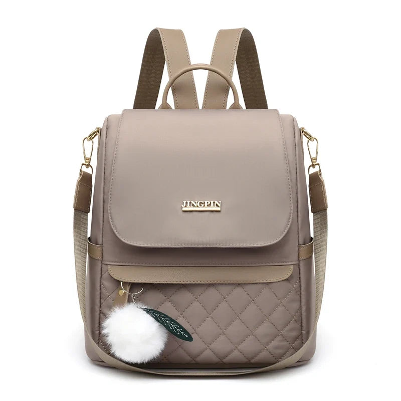 Quilted Mini Backpack Purse, Stylish Convertible Shoulder Bag with Flap Closure, Compact Daypack with Adjustable Straps & Pom Pom Charm