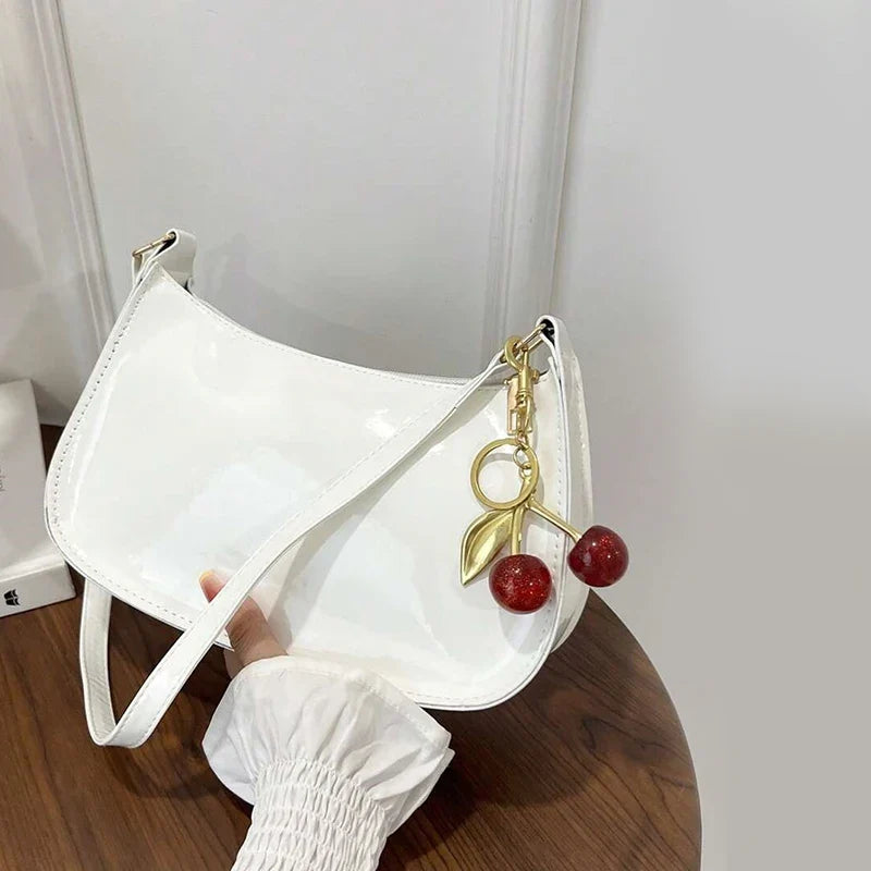Glossy Hobo Shoulder Bag, Sleek Crescent Handbag with Adjustable Strap, Compact Crossbody Purse with Decorative Charms for Dates & Everyday Use